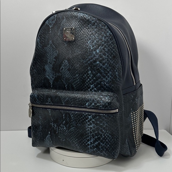 MCM Handbags - 💯Authentic MCM Snakeskin Embossed Visetos Studded Medium Stark Backpack🍀